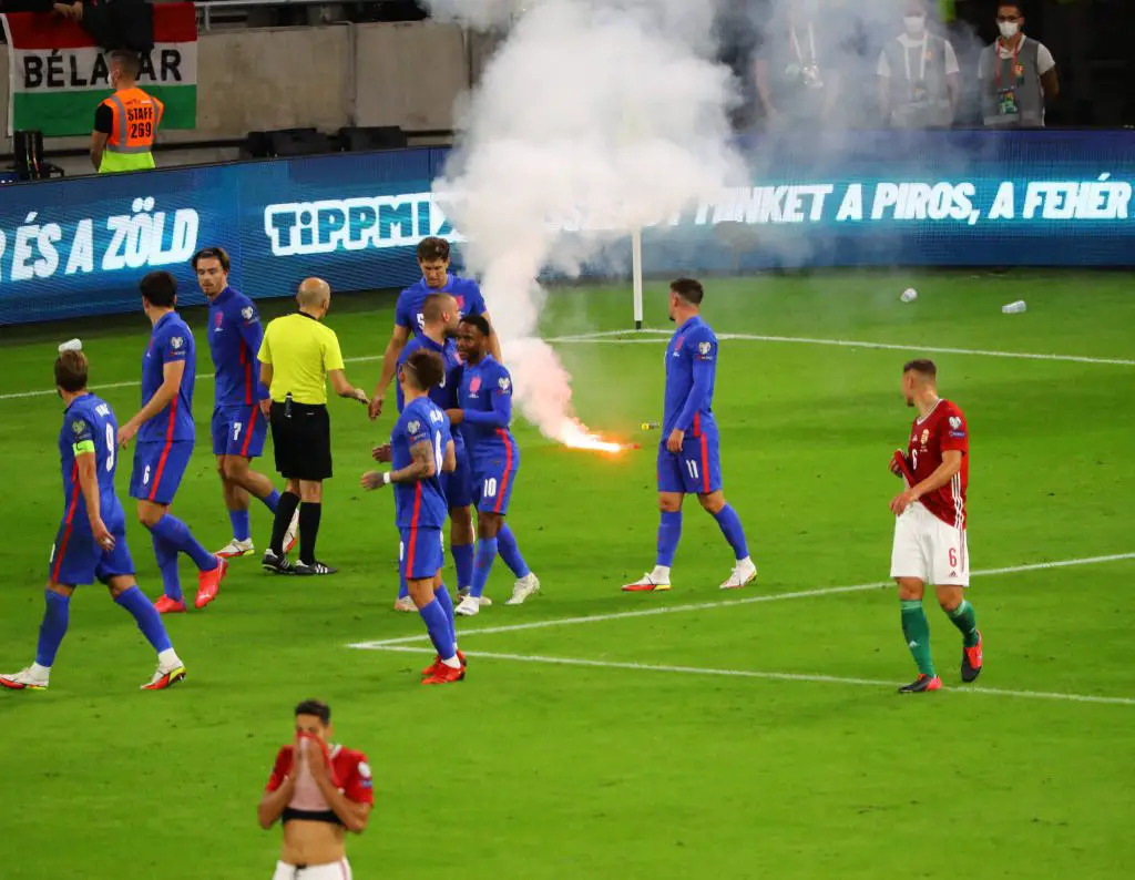 Cups and flares were thrown at England players as Harry Kane was also on the field.