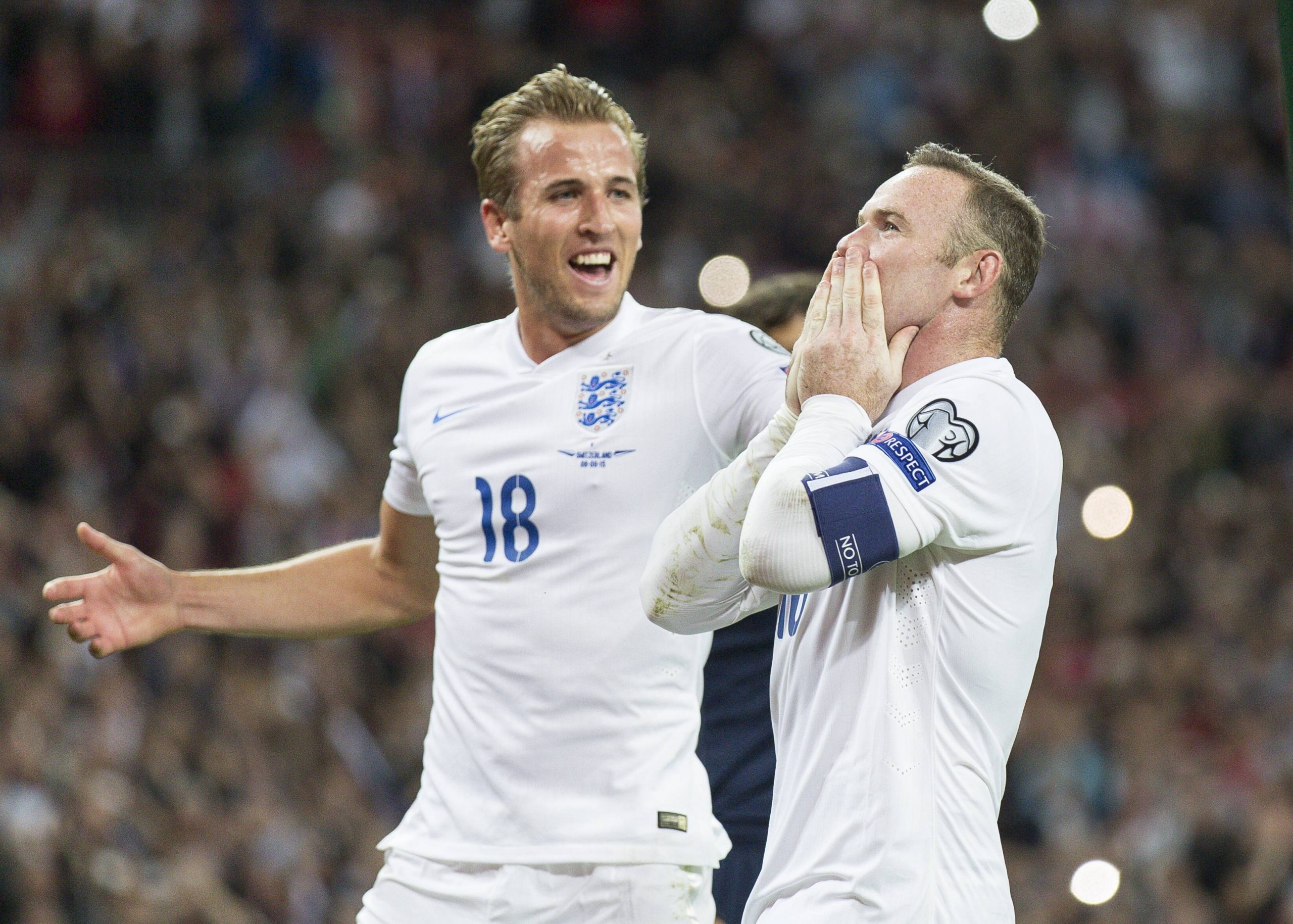England s Harry Kane rushes in to congratulate team mate Wayne Rooney after he scored the goal that broke the England goals record