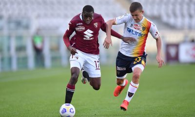 Wilfried Singo of Torino FC is challenged by John Gunnar Bjorkengren of US Lecce. (Photo by Valerio Pennicino/Getty Images)