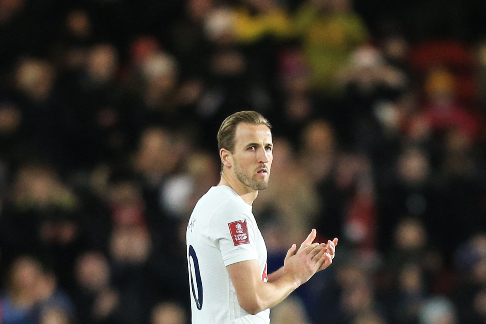 Harry Kane applauds Tottenham Hotspur fans. (Photo by LINDSEY PARNABY/AFP via Getty Images)