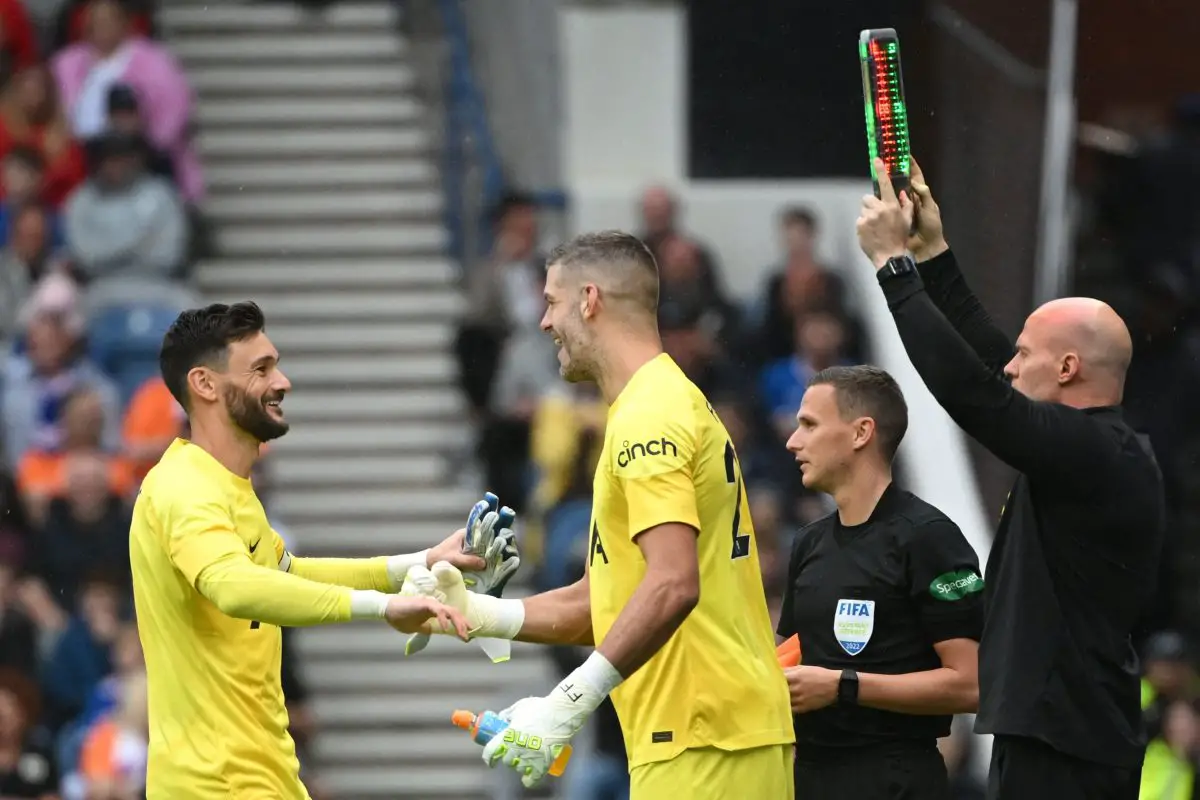 Tottenham Hotspur's French goalkeeper Hugo Lloris (L) leaves the pitch as he is replaced by Tottenham Hotspur's English goalkeeper Fraser Forster during the friendly football match between Rangers and Tottenham Hotspur at the Ibrox Stadium in Glasgow on July 23, 2022. - RESTRICTED TO EDITORIAL USE. No use with unauthorized audio, video, data, fixture lists, club/league logos or 'live' services. Online in-match use limited to 120 images. An additional 40 images may be used in extra time. No video emulation. Social media in-match use limited to 120 images. An additional 40 images may be used in extra time. No use in betting publications, games or single club/league/player publications. (Photo by Andy Buchanan / AFP) / RESTRICTED TO EDITORIAL USE. No use with unauthorized audio, video, data, fixture lists, club/league logos or 'live' services. Online in-match use limited to 120 images. An additional 40 images may be used in extra time. No video emulation. Social media in-match use limited to 120 images. An additional 40 images may be used in extra time. No use in betting publications, games or single club/league/player publications. / RESTRICTED TO EDITORIAL USE. No use with unauthorized audio, video, data, fixture lists, club/league logos or 'live' services. Online in-match use limited to 120 images. An additional 40 images may be used in extra time. No video emulation. Social media in-match use limited to 120 images. An additional 40 images may be used in extra time. No use in betting publications, games or single club/league/player publications. (Photo by ANDY BUCHANAN/AFP via Getty Images)