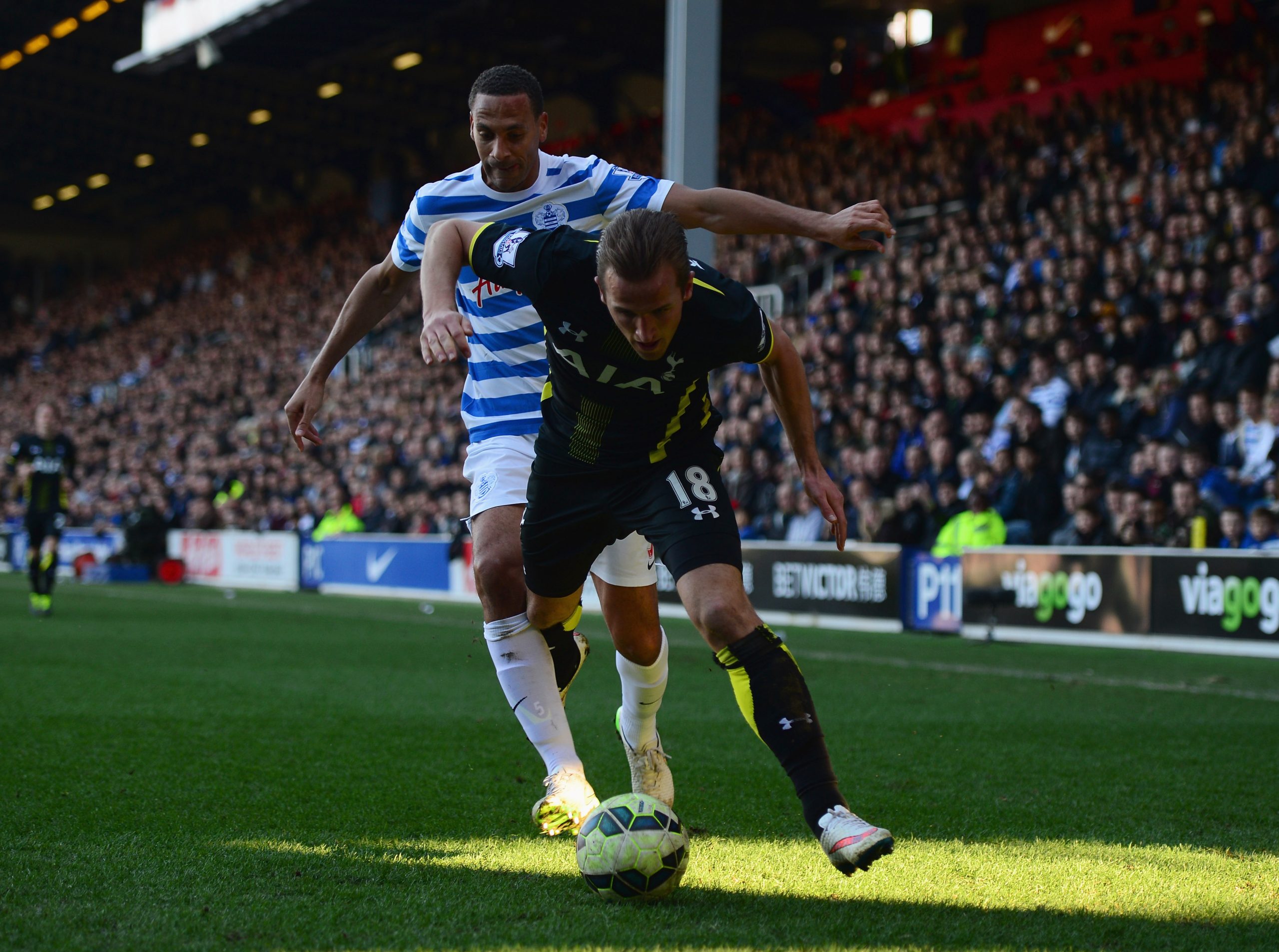 Harry Kane of Spurs evades Rio Ferdinand of QPR during a Barclays Premier League match in March, 2015.