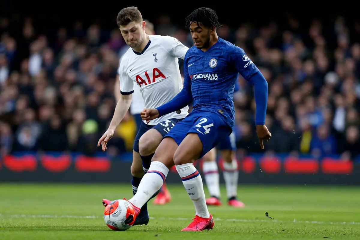 Tottenham Hotspur defender, Ben Davies, vies for the ball with Chelsea's Reece James. 