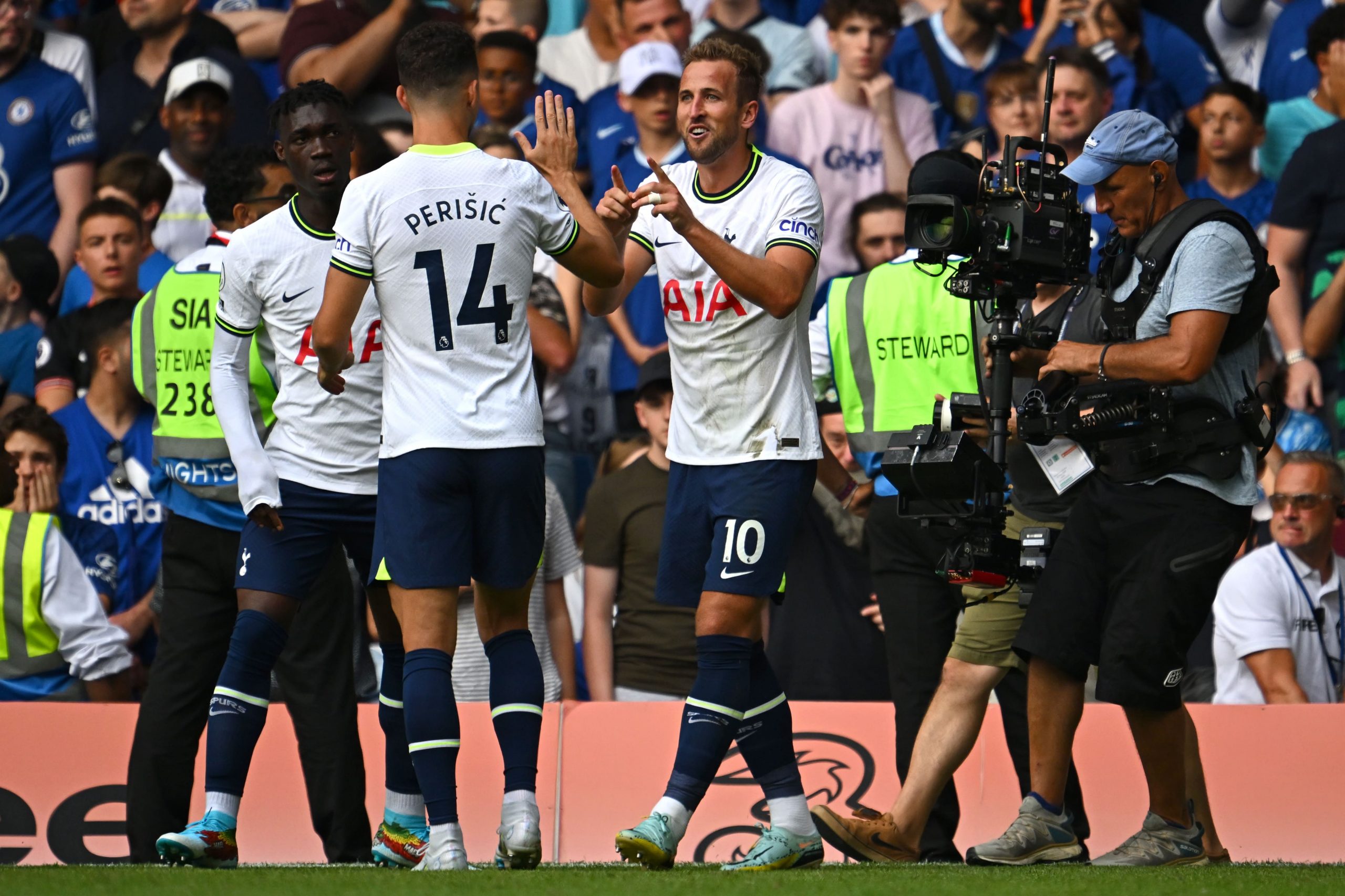 Harry Kane of Tottenham Hotspur celebrates with Ivan Perisic after scoring against Chelsea.