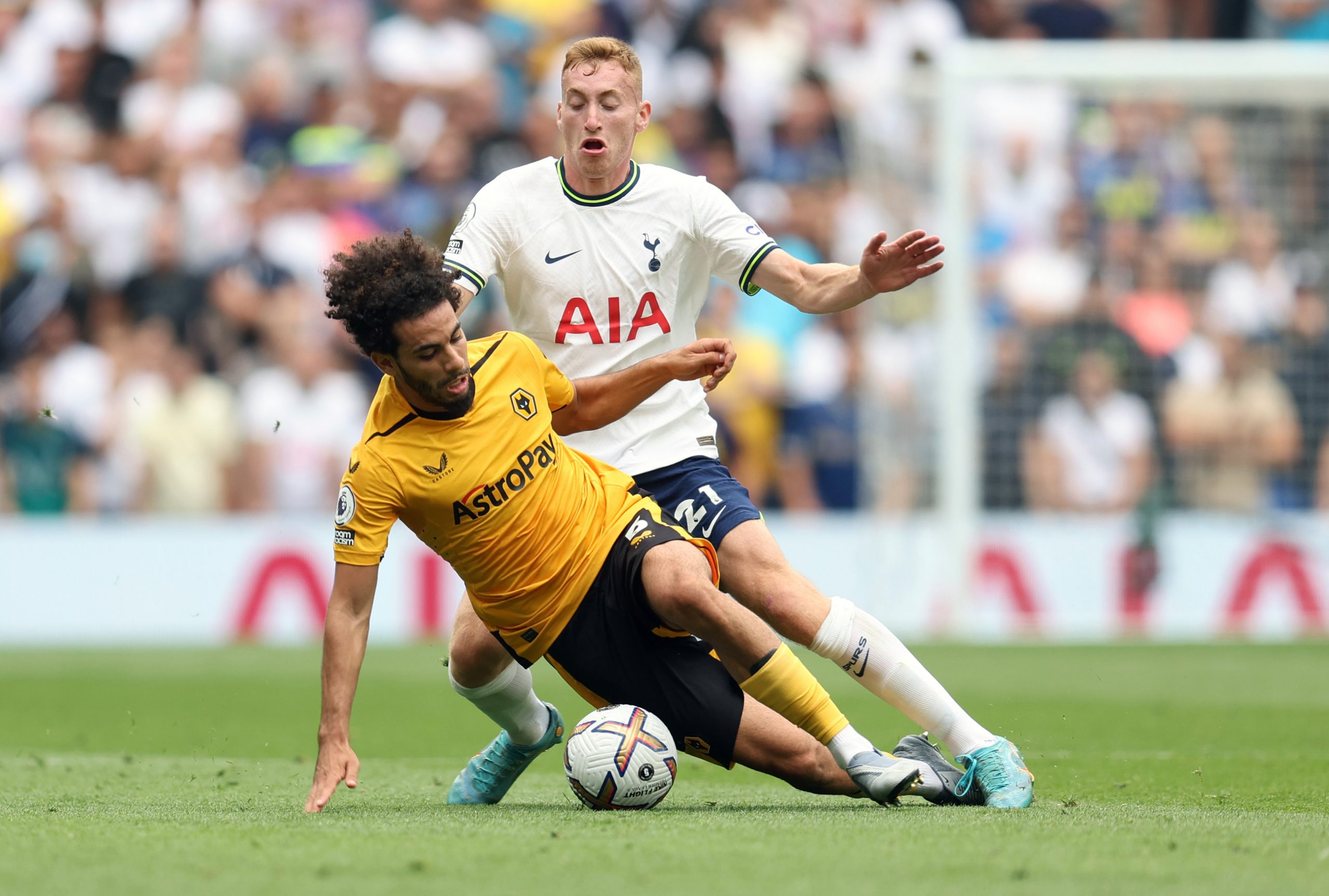Rayan Ait-Nouri of Wolverhampton Wanderers is tackled by Dejan Kulusevski of Tottenham Hotspur.