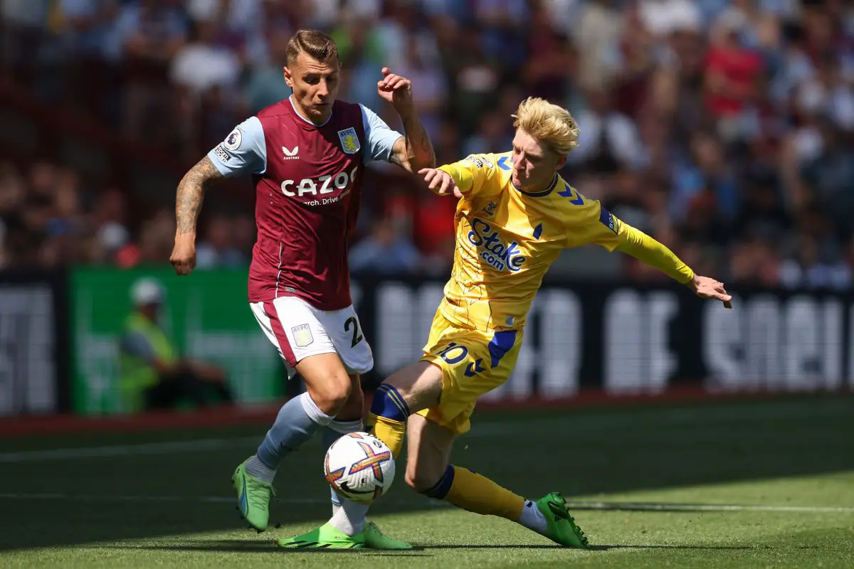 Lucas Digne of Aston Villa and Anthony Gordon of Everton compete for the ball.