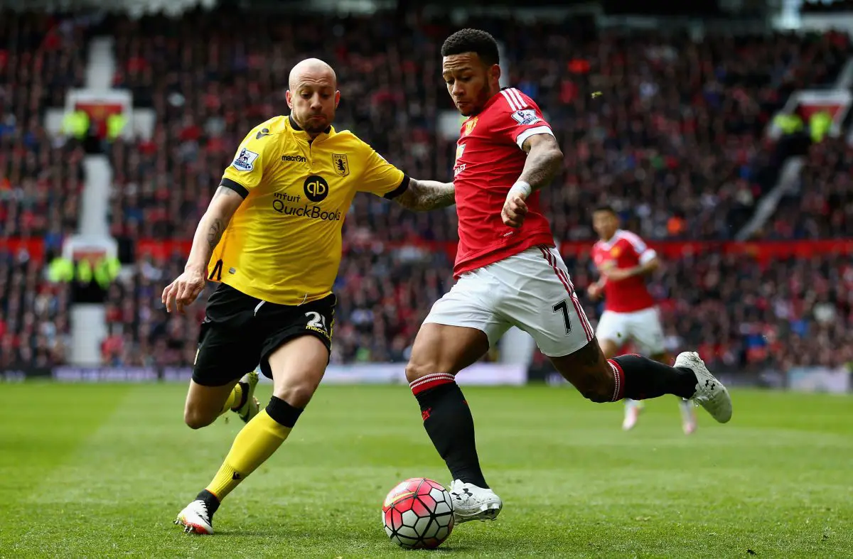 Memphis Depay of Manchester United is challenged by Alan Hutton of Aston Villa. (Photo by Clive Brunskill/Getty Images)