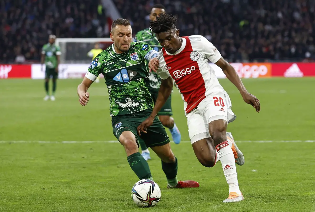 PEC Zwolle defender, Bram van Polen, fights for the ball against Ajax midfielder, Mohammed Kudus. 