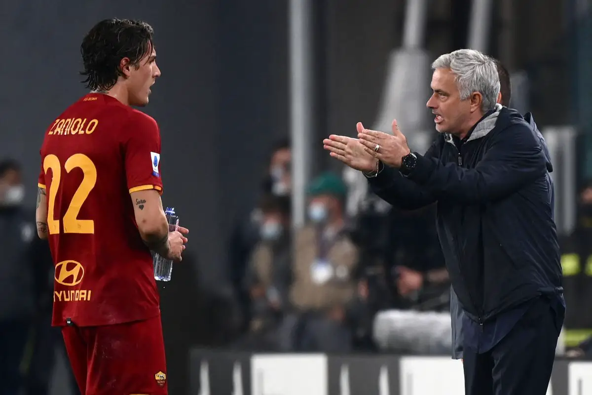 Jose Mourinho gives instructions to Nicolo Zaniolo during a game against Juventus. (Photo by MARCO BERTORELLO/AFP via Getty Images)