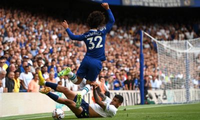 Marc Cucurella of Chelsea is challenged by Cristian Romero of Tottenham Hotspur.
