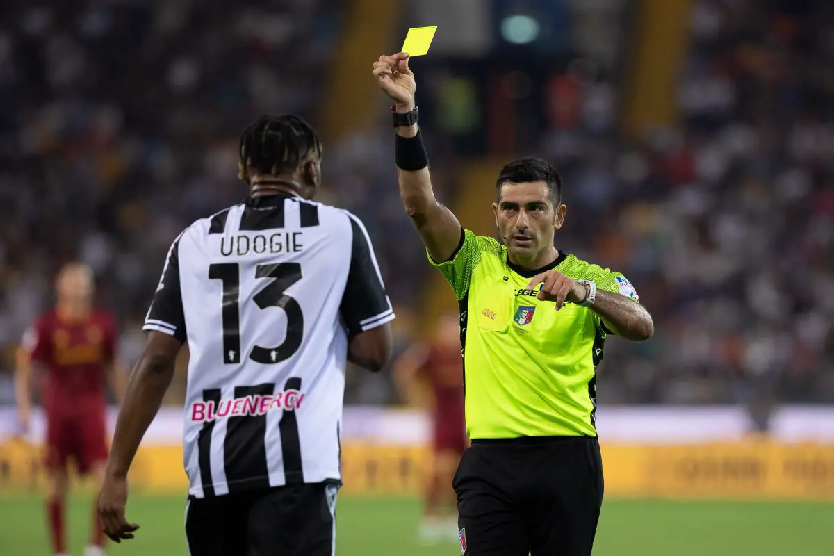 Fabio Maresca shows a yellow card to Destiny Udogie of Udinese Calcio.