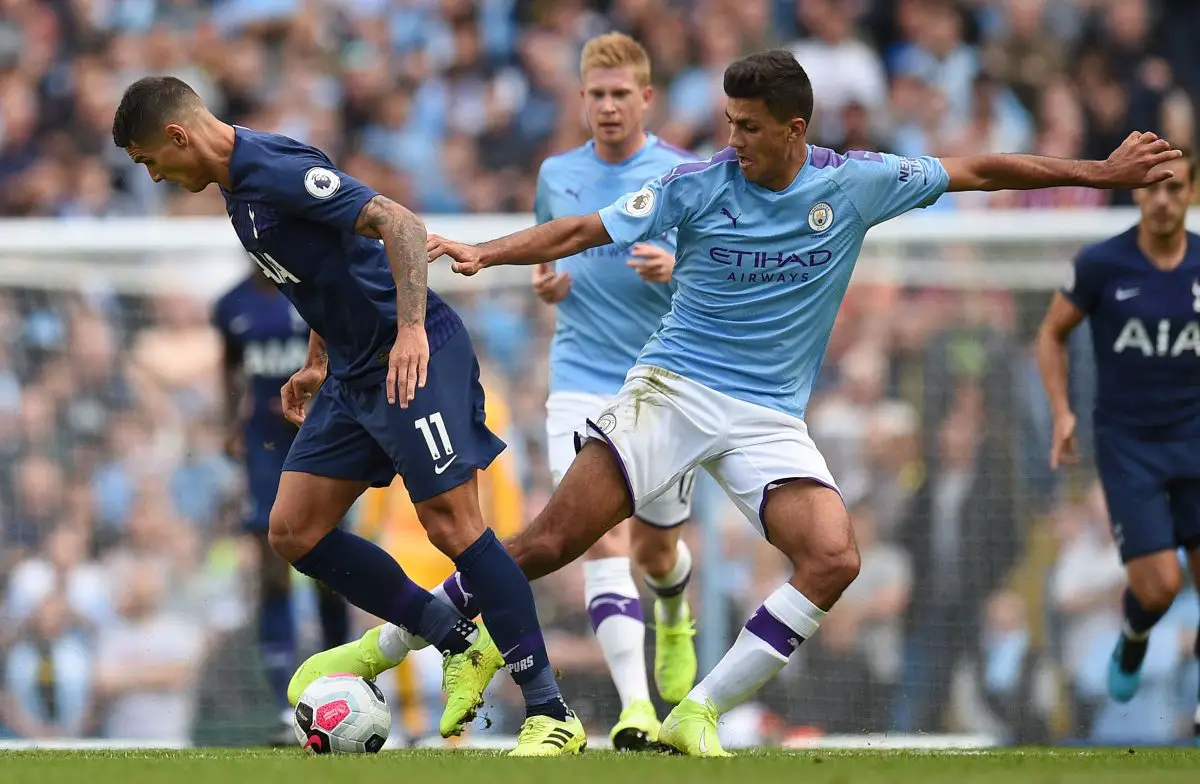 Tottenham's Erik Lamela vies with Manchester City's Rodri.