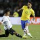 Cristian Romero of Argentina competes for the ball with Lucas Paqueta of Brazil.