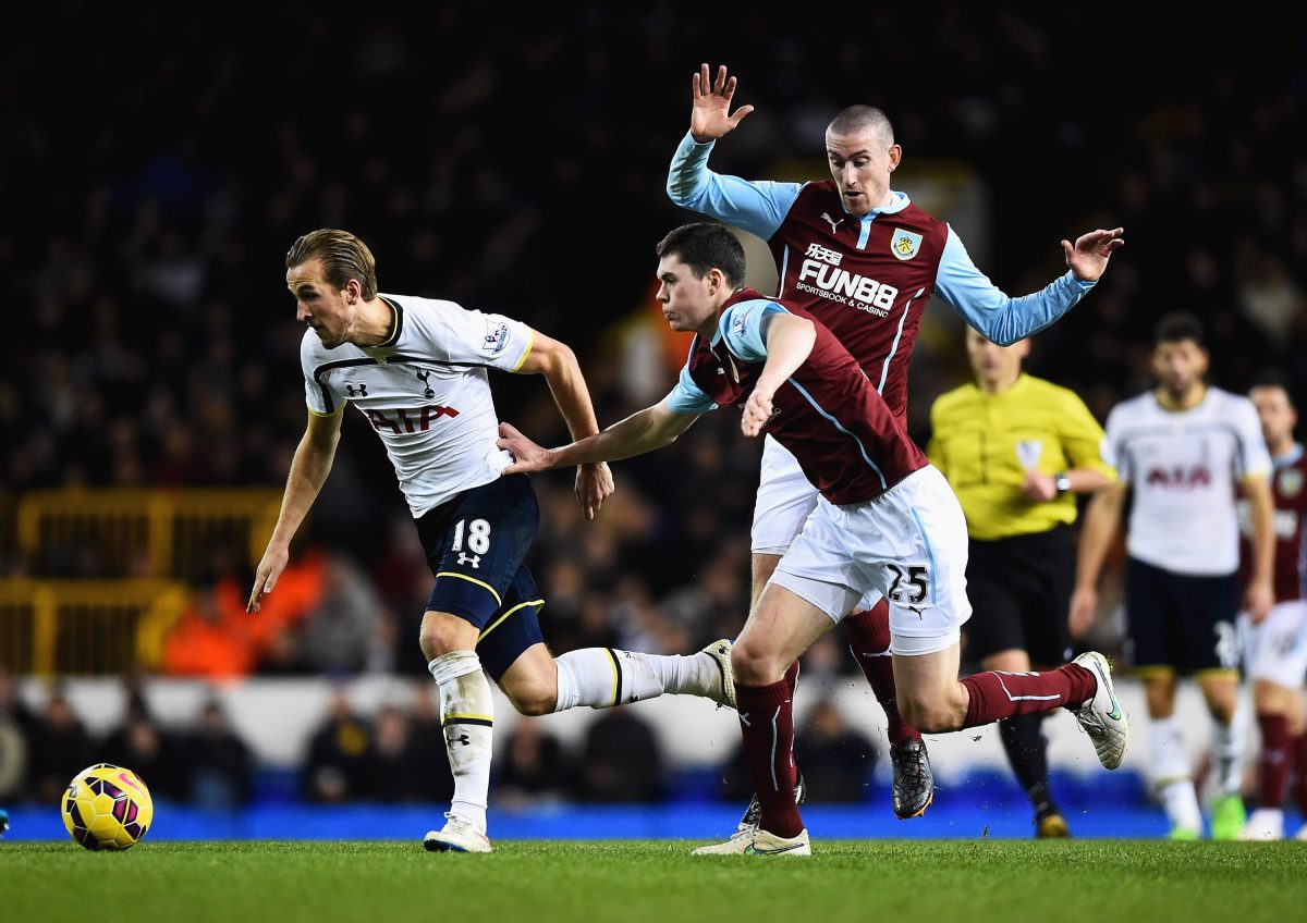 Harry Kane of Tottenham Hotspur is closed down by Michael Keane of Burnley during a Premier League game in December 2014.  