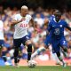Richarlison of Tottenham Hotspur is challenged by N'Golo Kante of Chelsea.