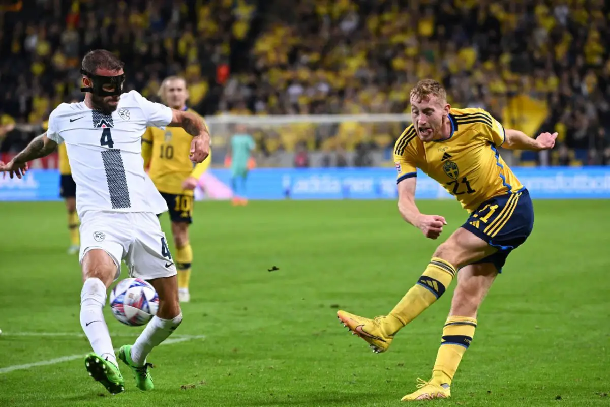 Slovenia's Miha Blazic tries to block a pass by Tottenham Hotspur and Sweden's Dejan Kulusevski.
