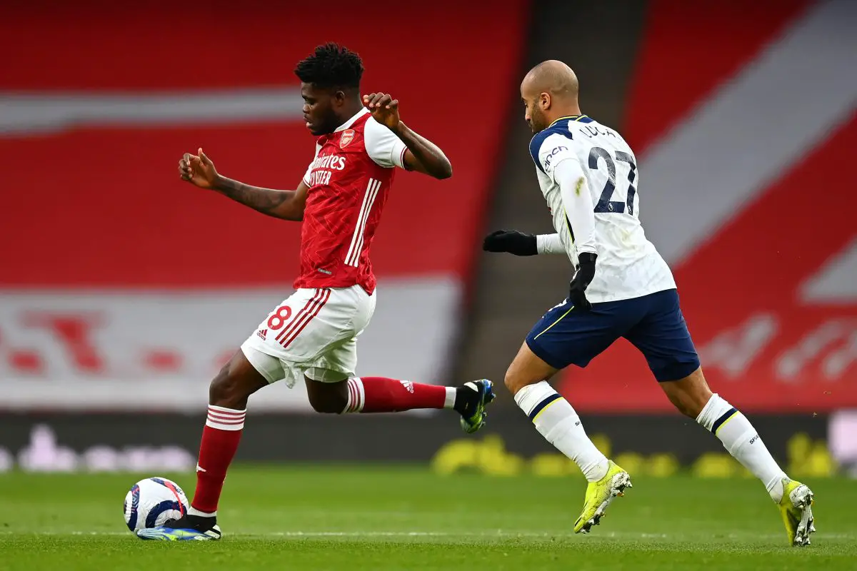 Thomas Partey of Arsenal in action against Lucas Moura of Tottenham Hotspur.