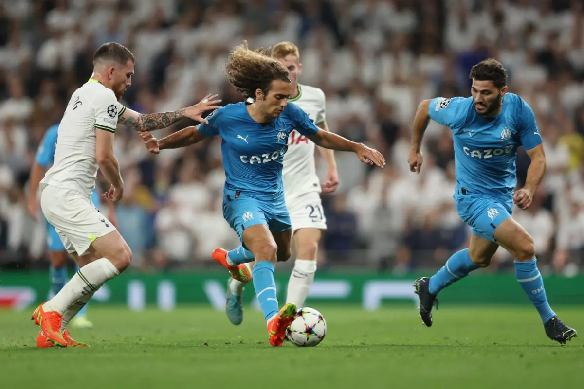 Matteo Guendouzi of Marseille runs with the ball under pressure from Pierre-Emile Hojbjerg of Tottenham Hotspur. (Photo by Richard Heathcote/Getty Images)
