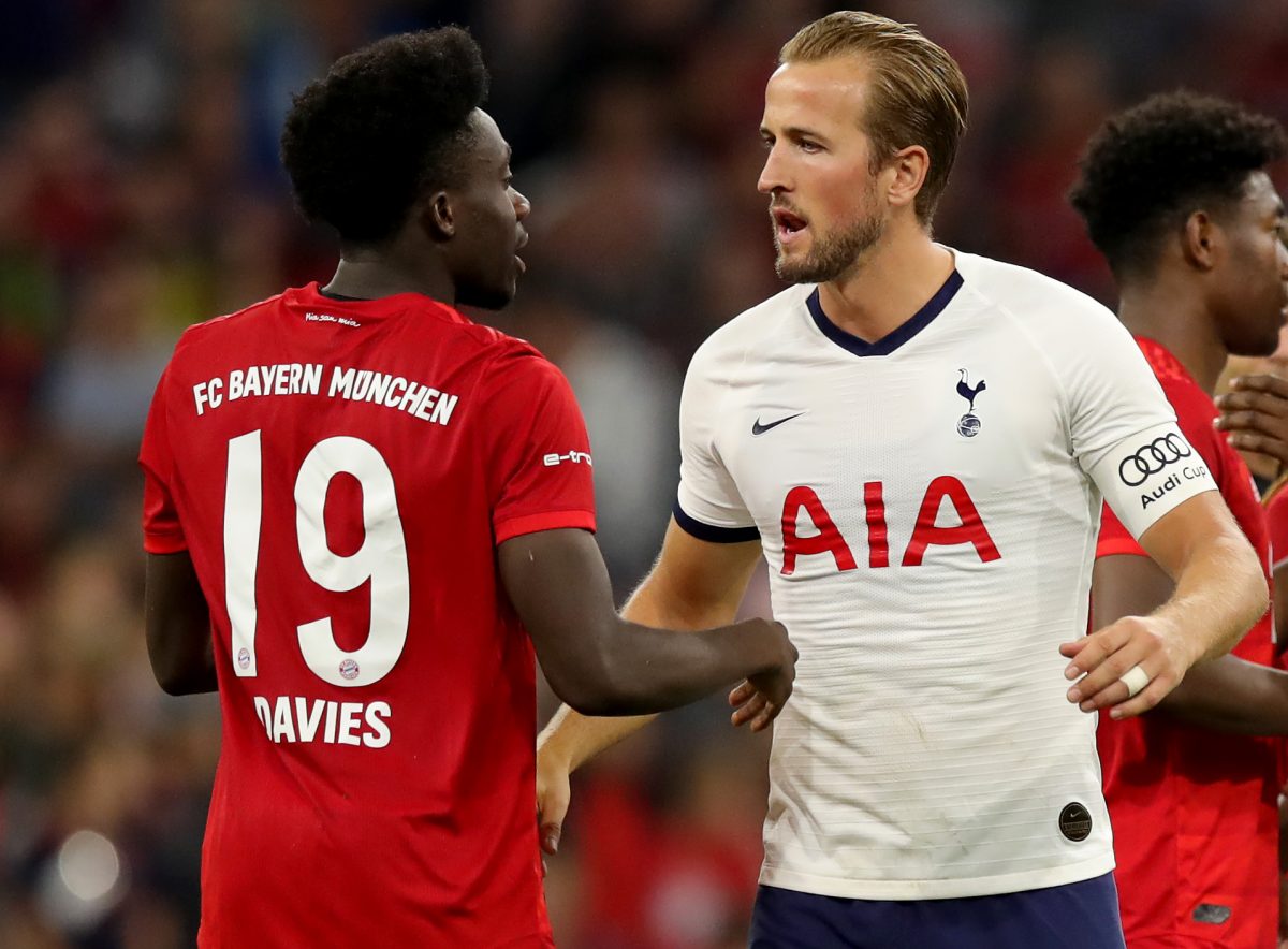 Alphonso Davies of FC Bayern Munich congratulates Harry Kane of Tottenham Hotspur.