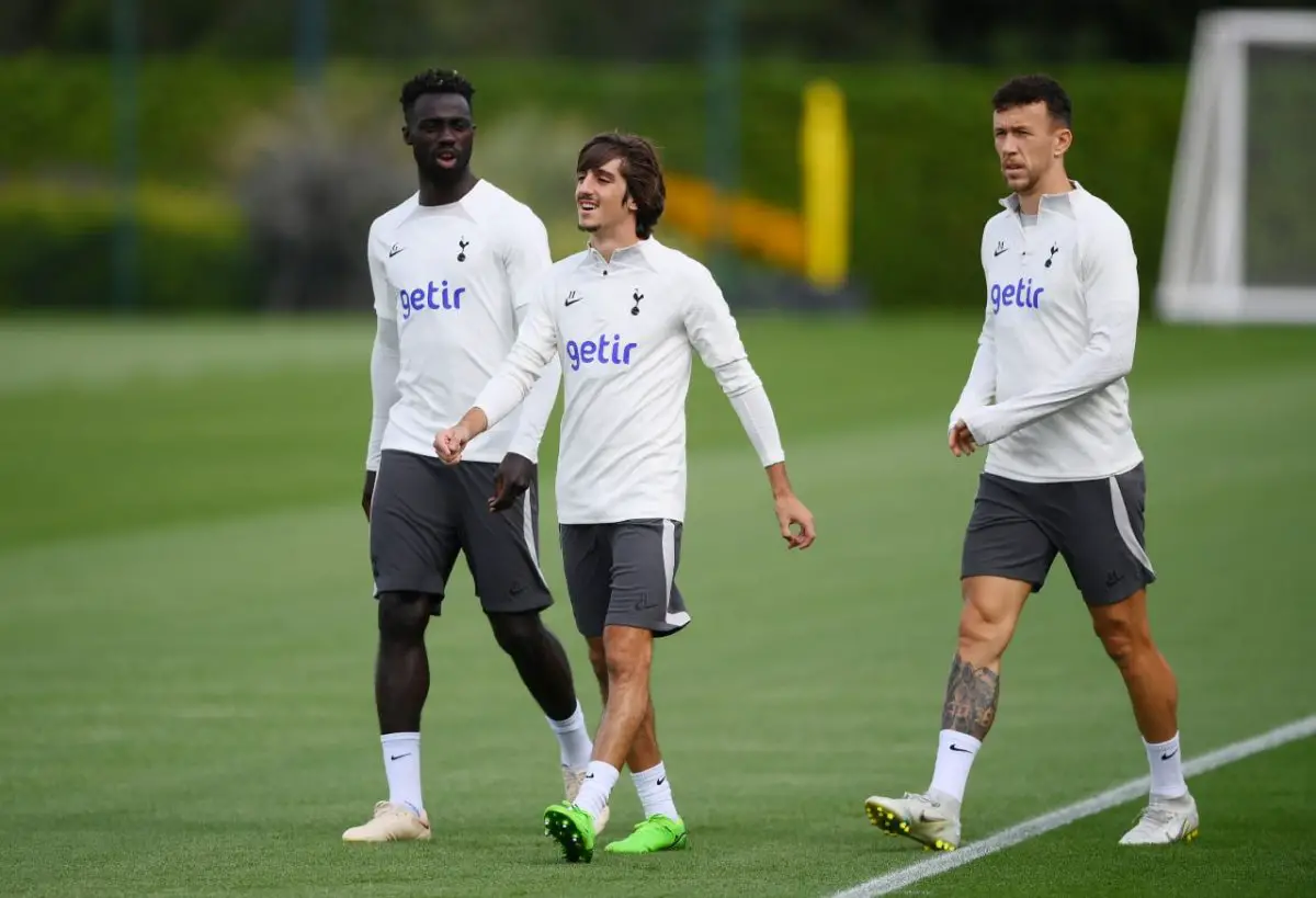 Davinson Sanchez, Bryan Gil, and Ivan Perisic look on during a Tottenham Hotspur training session. 