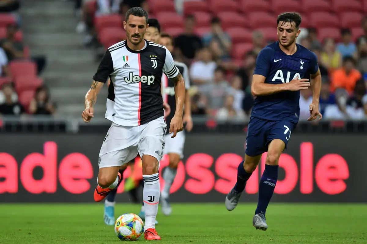 Leonardo Bonucci of Juventus runs with the ball as Erik Lamela of Tottenham Hotspur watches on during a friendly in 2019.