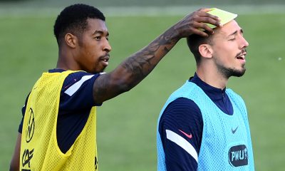 Presnel Kimpembe (L) jokes with France's Clement Lenglet during a training session.