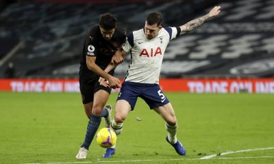 Rodri of Manchester City battles for possession with Pierre-Emile Hojbjerg of Tottenham Hotspur.
