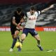 Rodri of Manchester City battles for possession with Pierre-Emile Hojbjerg of Tottenham Hotspur.