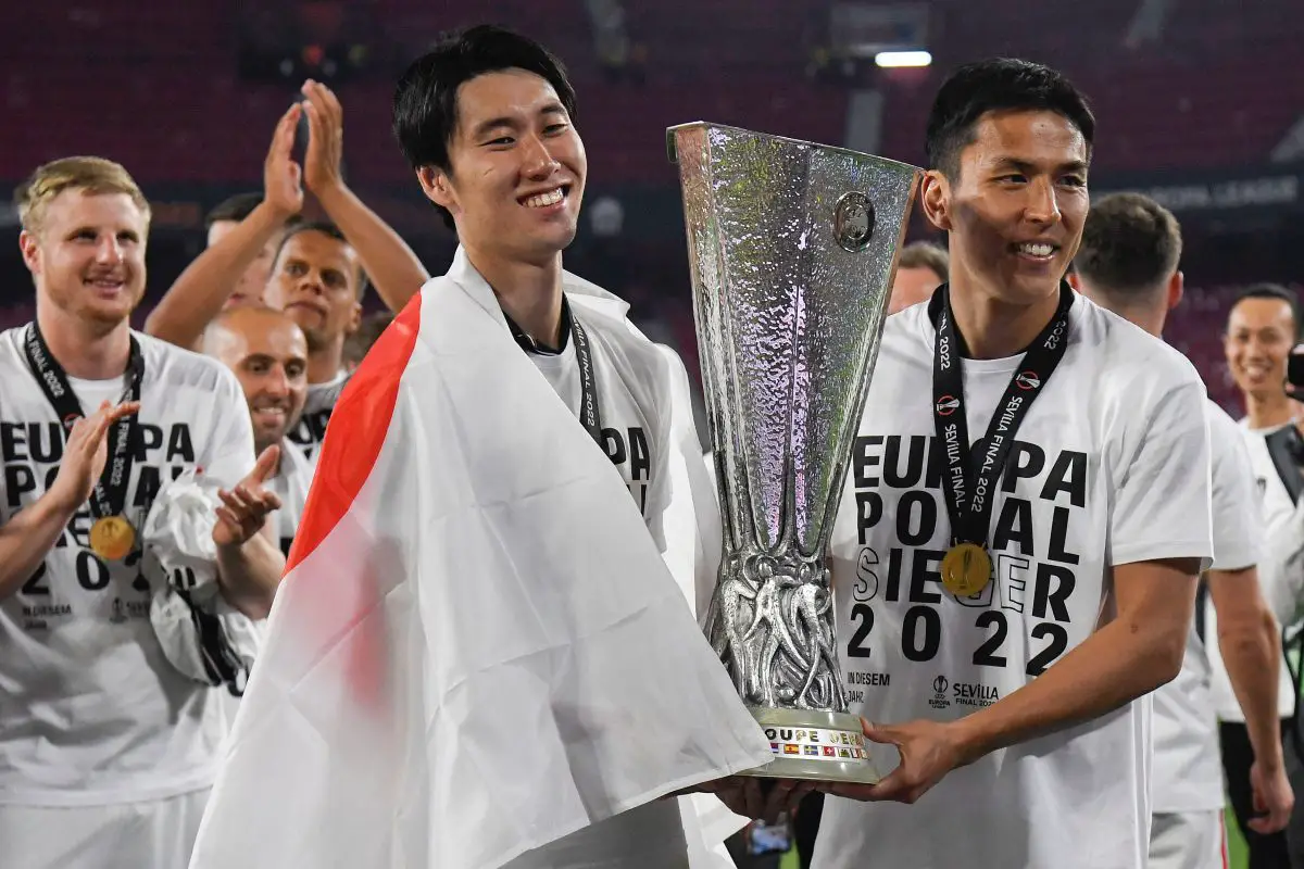 Daichi Kamada celebrates with Japan and Eintracht Frankfurt teammate, Makoto Hasebe, after they beat Rangers in the UEFA Europa League 2022 final. 