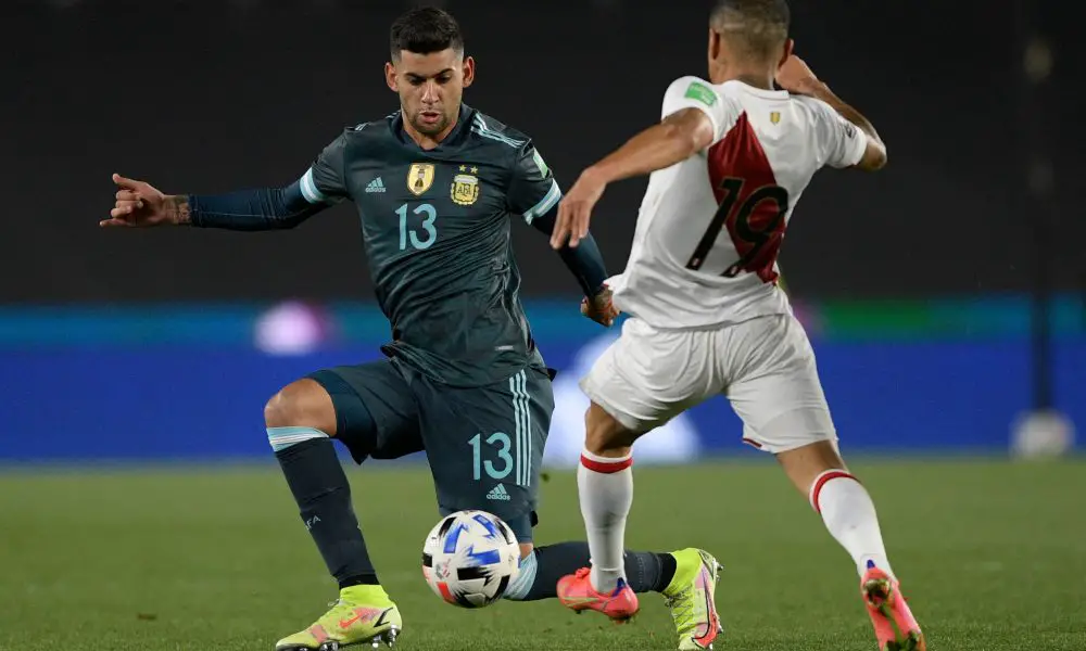 Argentina's Cristian Romero and Peru's Yoshimar Yotun vie for the ball.