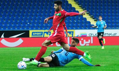 Iran's Mehdi Taremi and Uruguay's Rodrigo Bentancur vie for the ball during an international friendly.