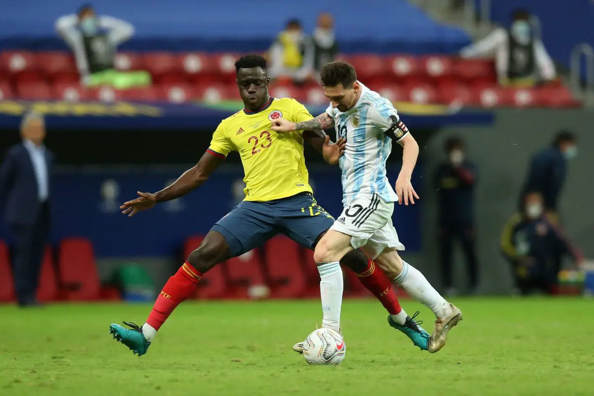 Lionel Messi of Argentina competes for the ball with Davinson Sanchez of Colombia. 