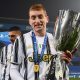 Dejan Kulusevski of Juventus celebrates with the PS5 Supercup after win against SSC Napoli.