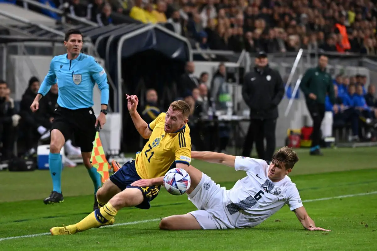 Tottenham Hotspur's Dejan Kulusevski and Jaka Bijol vie for the ball during the UEFA Nations League Group 4 football match between Sweden and Slovenia.