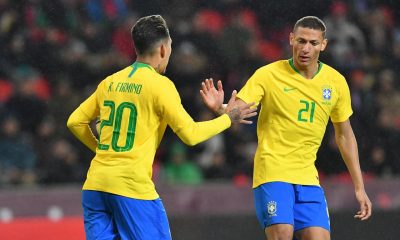Liverpool's Roberto Firmino celebrates with Richarlison after scoring for Brazil against Czech Republic in 2019.