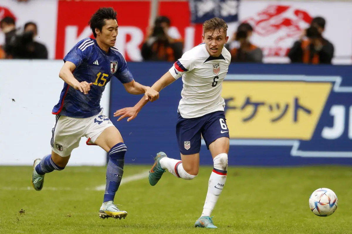 United States' Sam Vines and Japan's Daichi Kamada vie for the ball during a friendly.