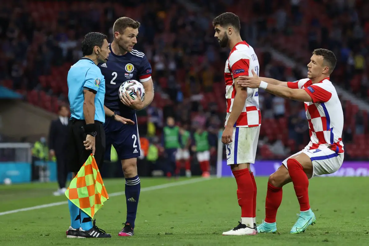 Ivan Perisic pulls Croatia's Josko Gvardiol as he confronts Scotland's Stephen O'Donnell during a UEFA Euro 2020 match.