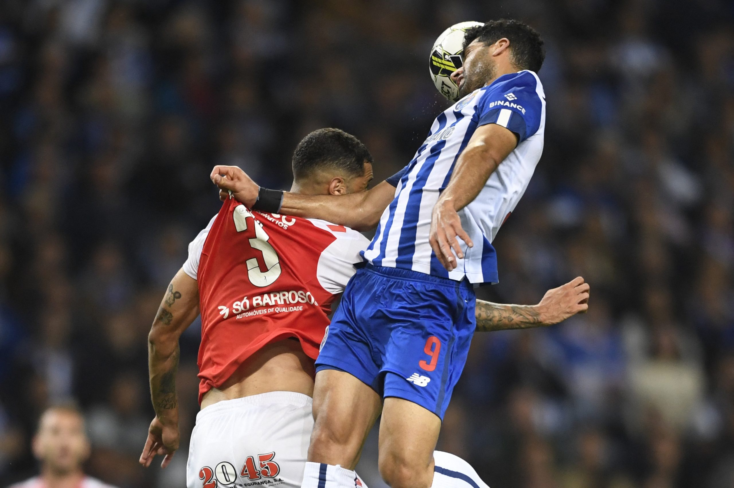FC Porto's Mehdi Taremi heads the ball as he vies with Sporting Braga's Vitor Tormena in a game that finished 4-1 for the Dragons.