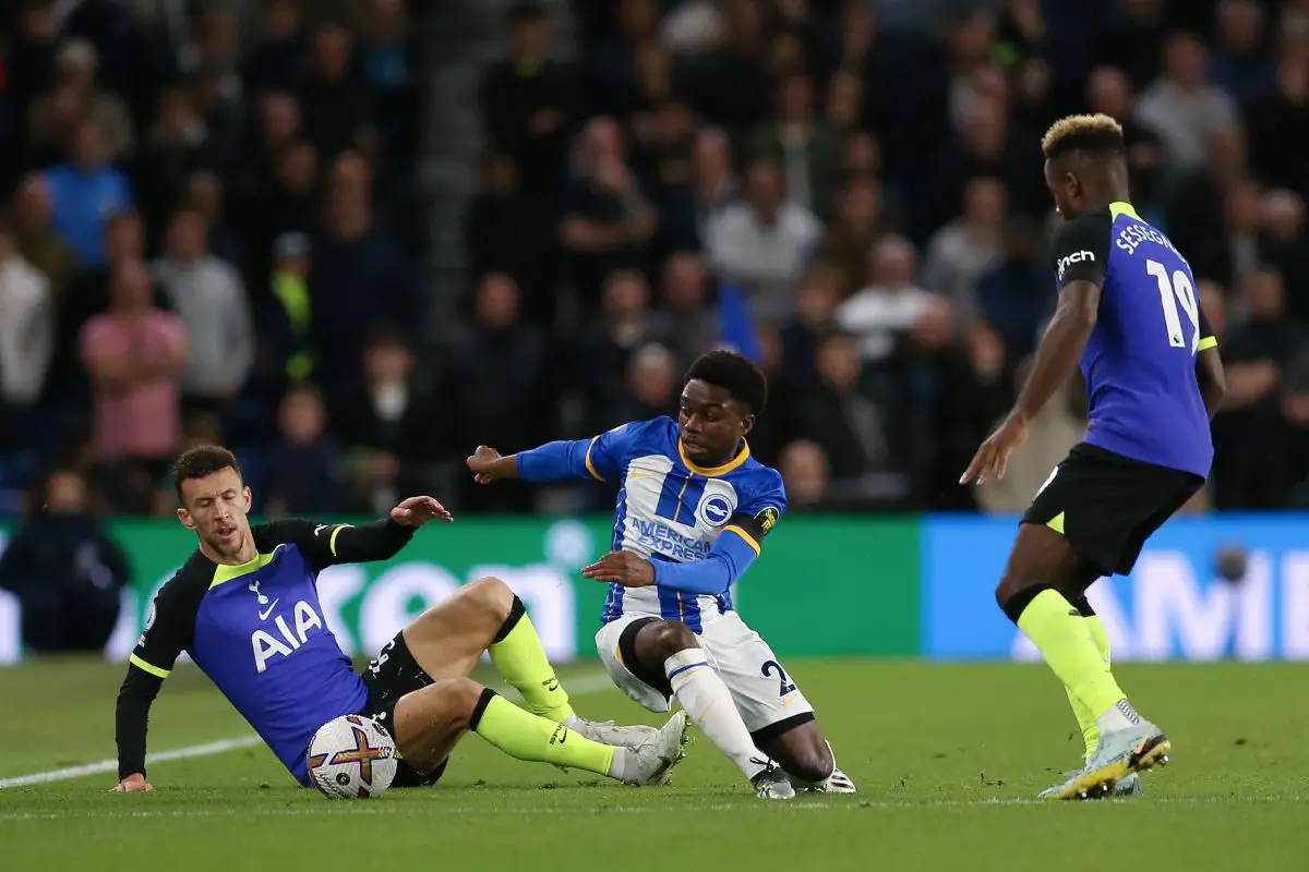 Tarique Lamptey of Brighton and Hove Albion is challenged by Ivan Perisic and Ryan Sessegnon of Tottenham Hotspur.