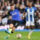 Tottenham Hotspur's Matt Doherty passes the ball as Brighton's Pervis Estupinan looks on during a match in October 2022. (Photo by GLYN KIRK/AFP via Getty Images)