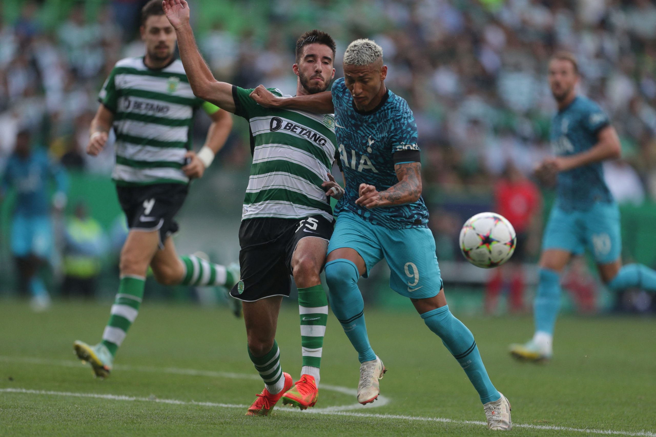 Sporting Lisbon's Manuel Ugarte fights for the ball with Tottenham Hotspur's Richarlison.