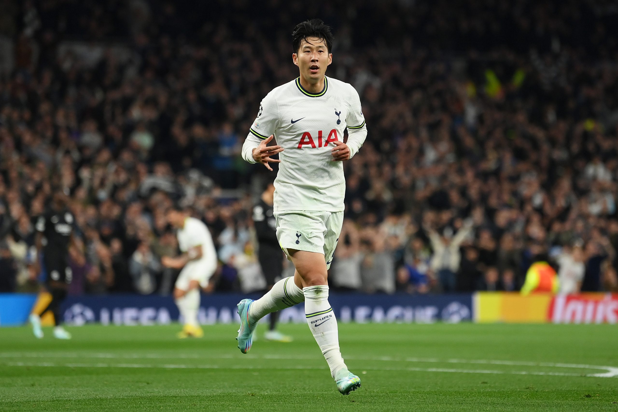 Son Heung-Min of Tottenham Hotspur celebrates after scoring against Eintracht Frankfurt.