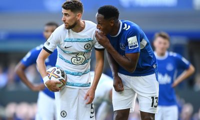 Jorginho of Chelsea speaks with Yerry Mina of Everton before taking a penalty.