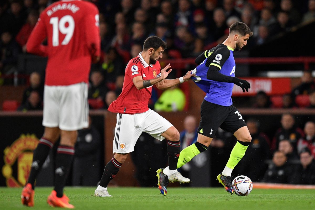 Manchester United's Bruno Fernandes fights for the ball with Tottenham Hotspur's Rodrigo Bentancur.