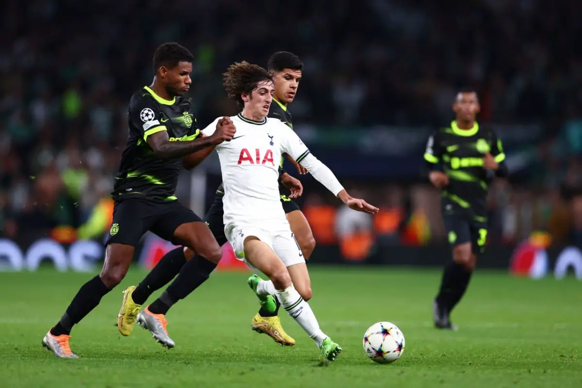 Bryan Gil of Tottenham Hotspur is tackled by Matheus Reis of Sporting CP. 