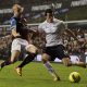 Alan Hutton of Aston Villa goes in for the tackle on Gareth Bale of Spurs