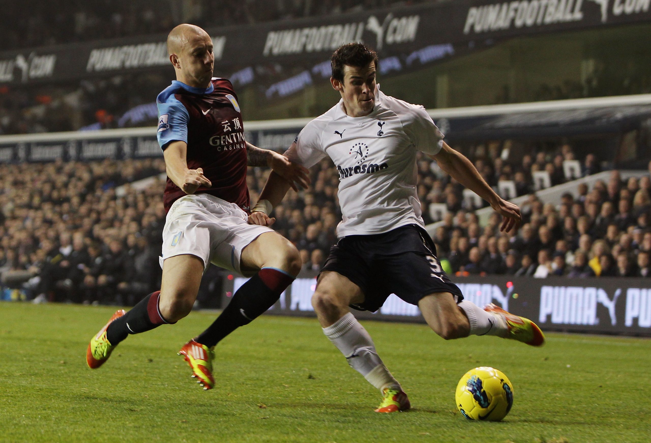 Alan Hutton of Aston Villa goes in for the tackle on Gareth Bale of Spurs