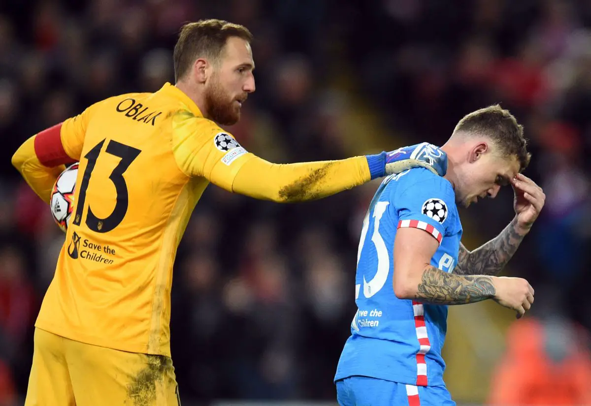 Atletico Madrid goalkeeper, Jan Oblak, checks on teammate Kieran Trippier during a UEFA Champions League game against Liverpool