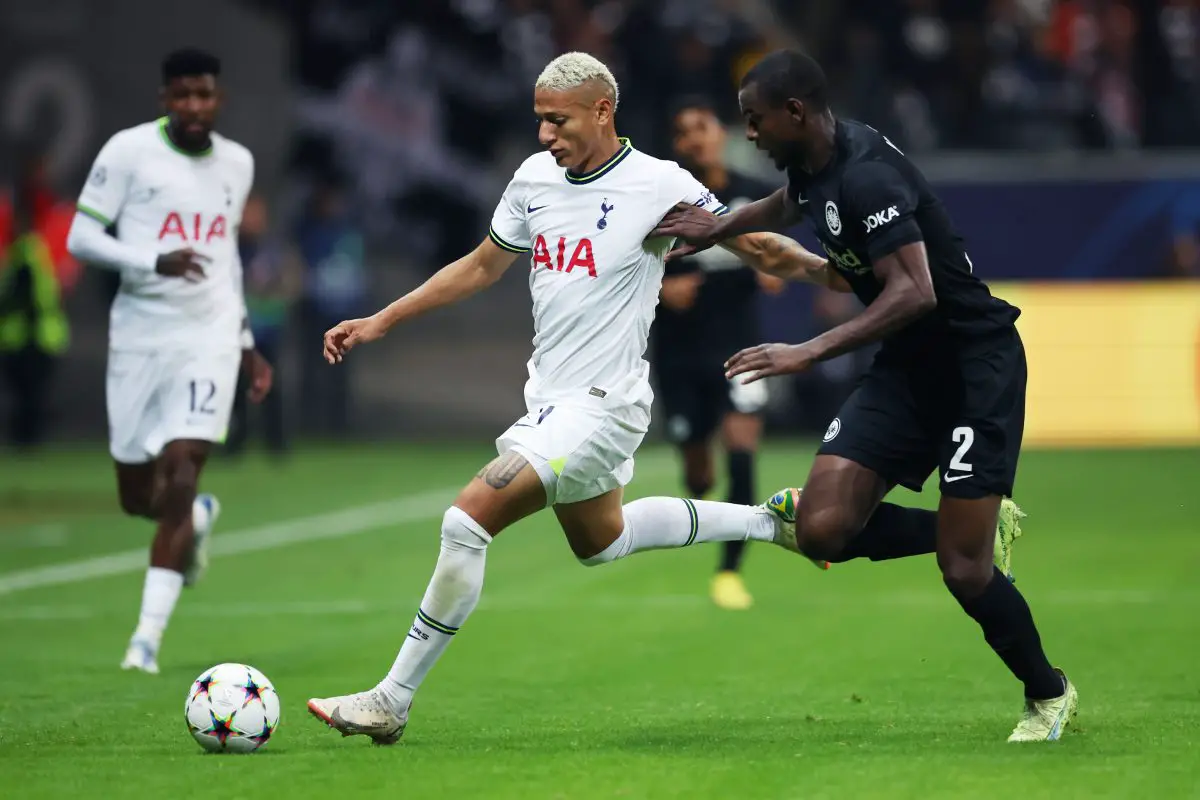 Richarlison of  Tottenham Hotspur is challenged by Evan N'Dicka of Eintracht Frankfurt in a UEFA Champions League group stage match in October 2022. 
