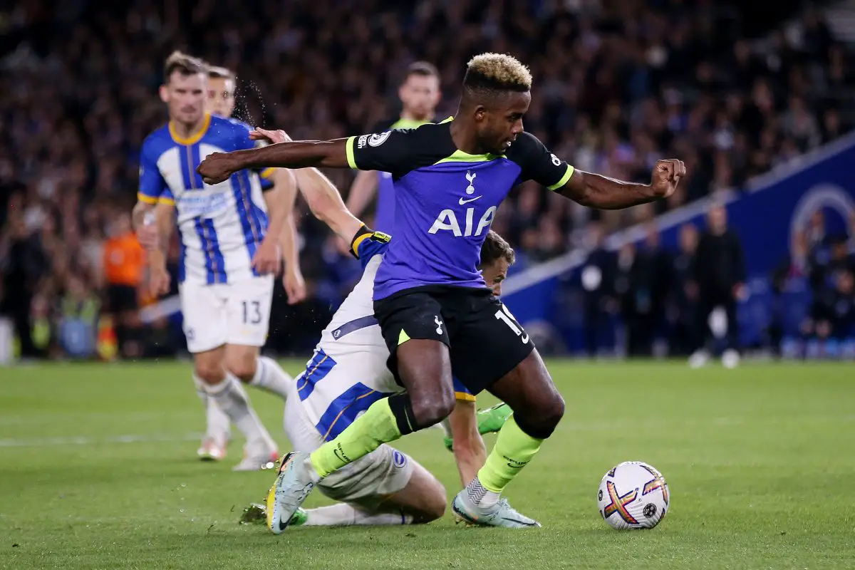 Ryan Sessegnon of Tottenham Hotspur runs with the ball from Solly March of Brighton.
